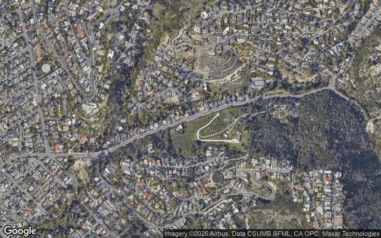 Satellite aerial view of Bluebird Canyon in Laguna Beach, California, showing the neighborhood's streets and surroundings.