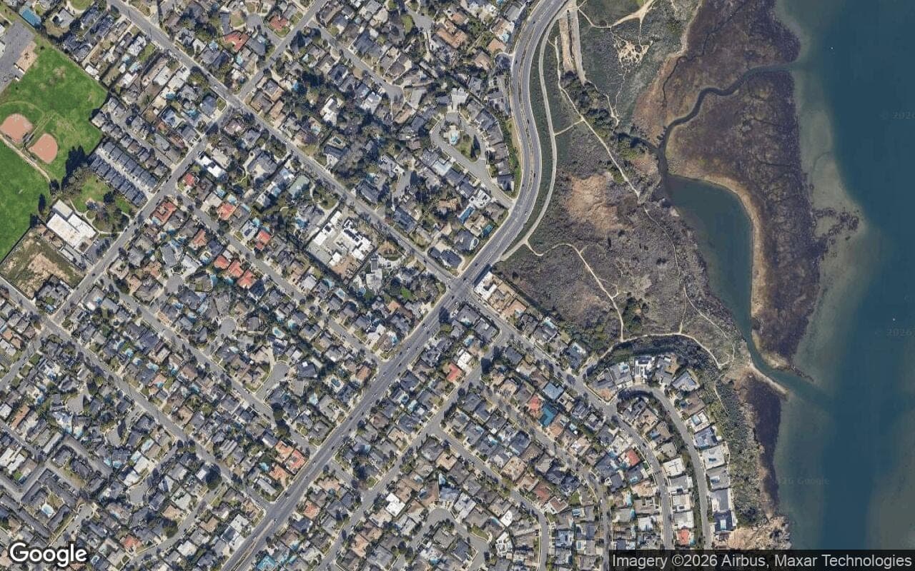 Satellite aerial view of Cherry Lake in Newport Beach, California, showing the neighborhood's streets and surroundings.