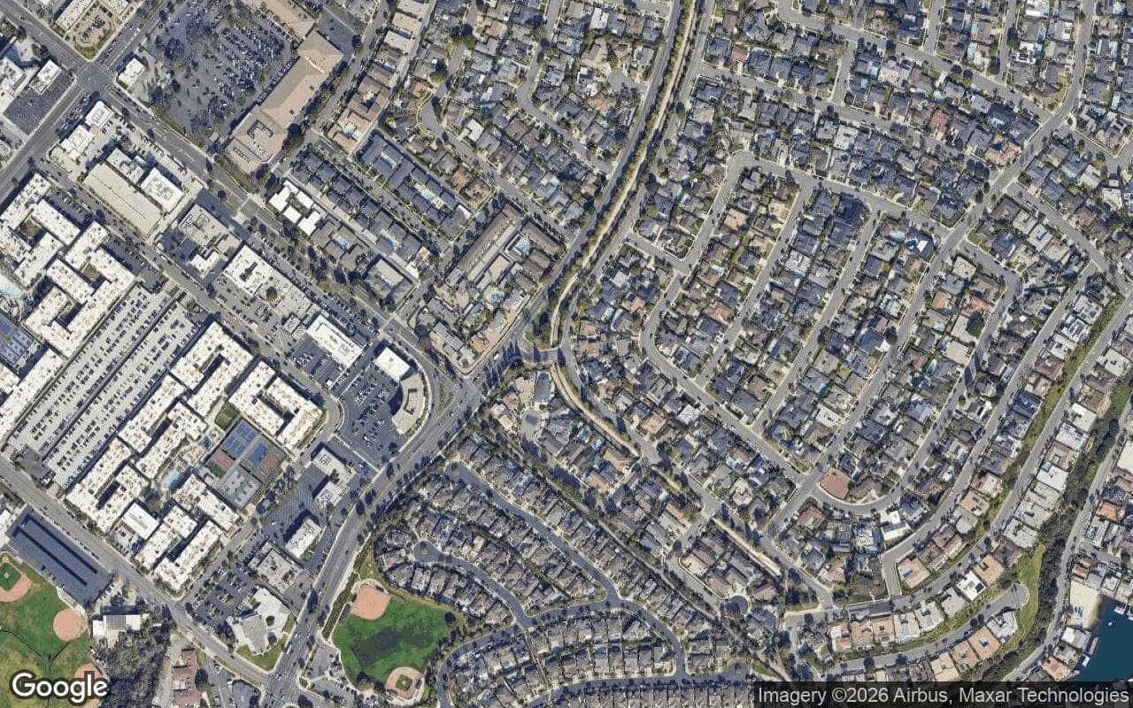 Satellite aerial view of Dover Village in Newport Beach, California, showing the neighborhood's streets and surroundings.
