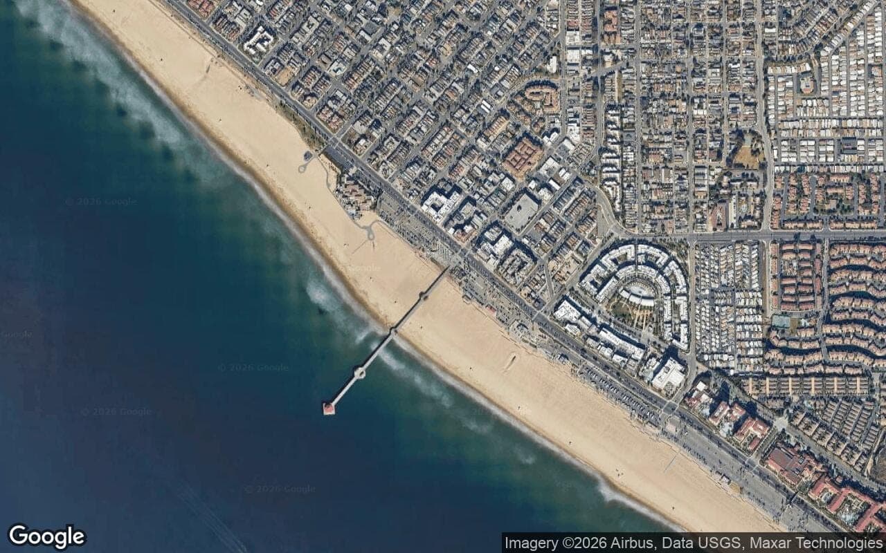 Satellite aerial view of Downtown Pier District in Huntington Beach, California, showing the neighborhood's streets and surroundings.