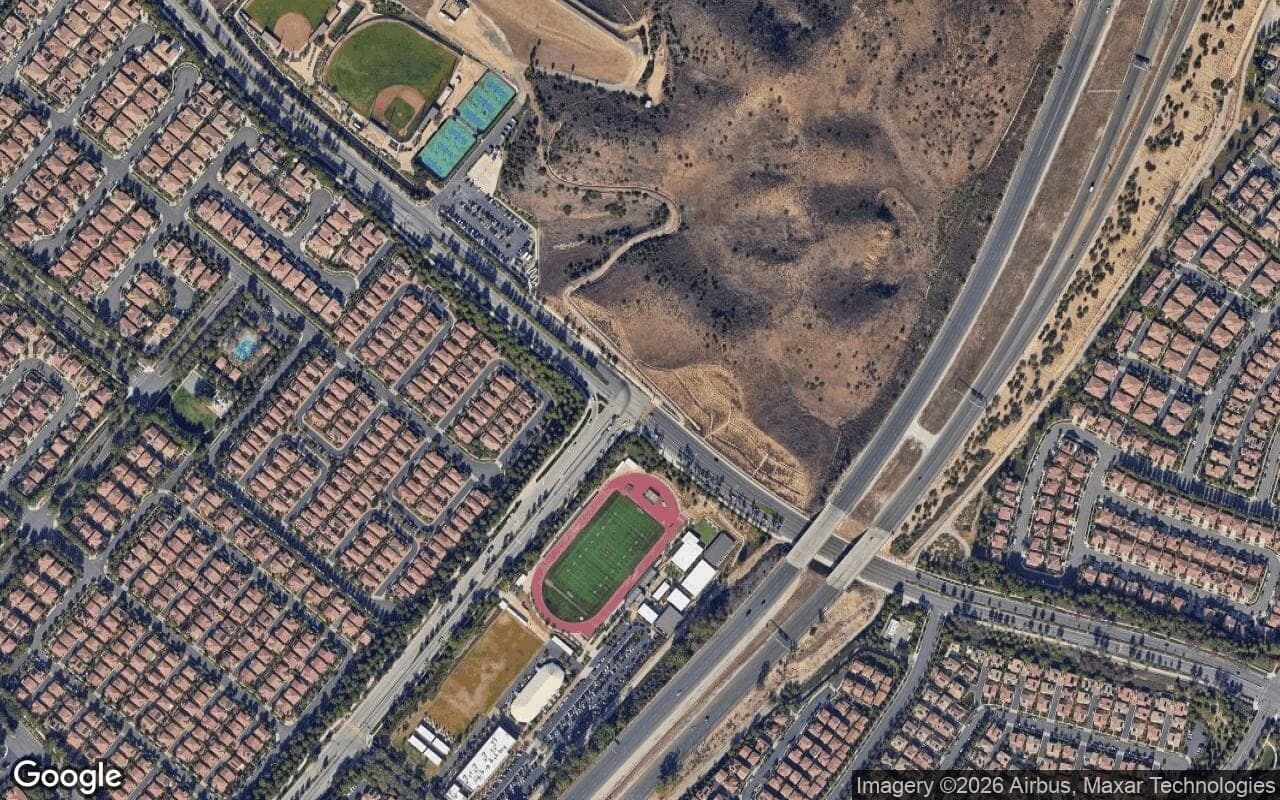 Satellite aerial view of Los Olivos in Irvine, California, showing the neighborhood's streets and surroundings.