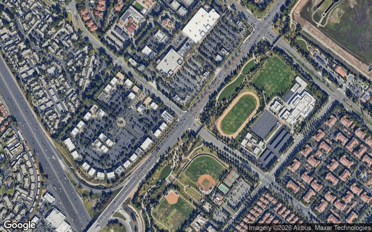 Satellite aerial view of Stonegate in Irvine, California, showing the neighborhood's streets and surroundings.