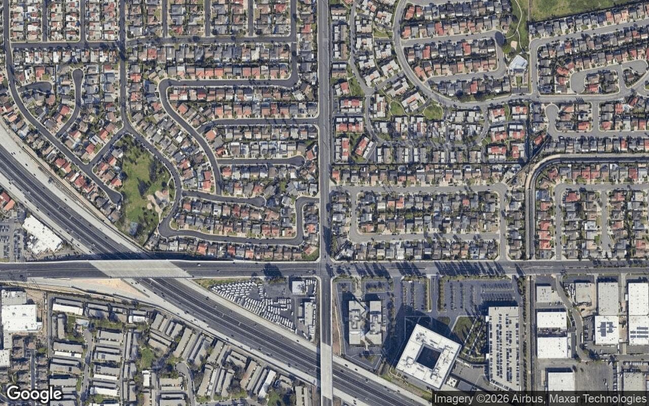 Satellite aerial view of Warner Village in Fountain Valley, California, showing the neighborhood's streets and surroundings.