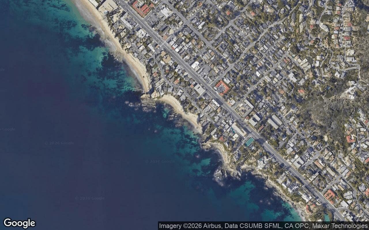 Satellite aerial view of Woods Cove in Laguna Beach, California, showing the neighborhood's streets and surroundings.