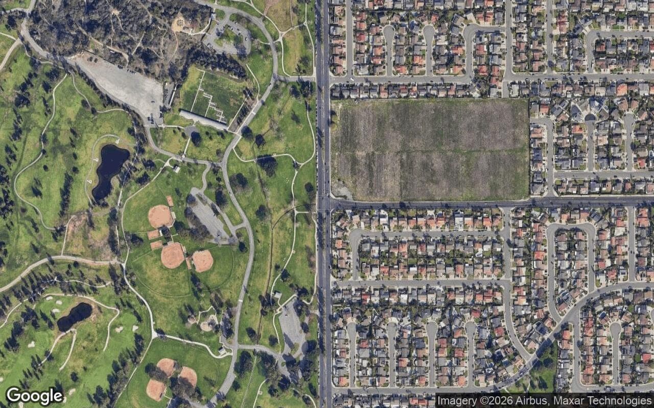 Satellite aerial view of Woodside in Fountain Valley, California, showing the neighborhood's streets and surroundings.