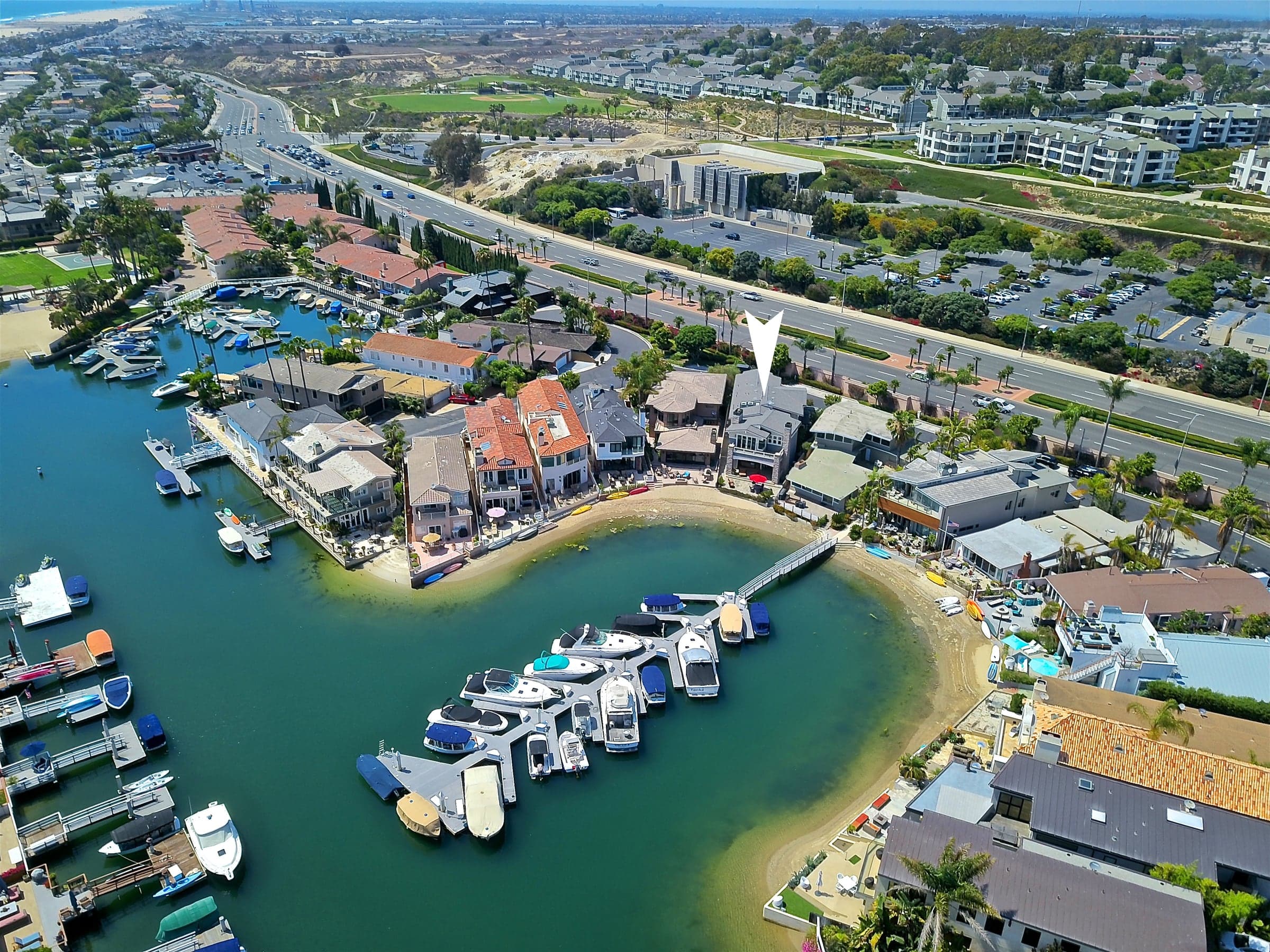 Aerial of the Balboa Coves waterfront community beside the Pacific.