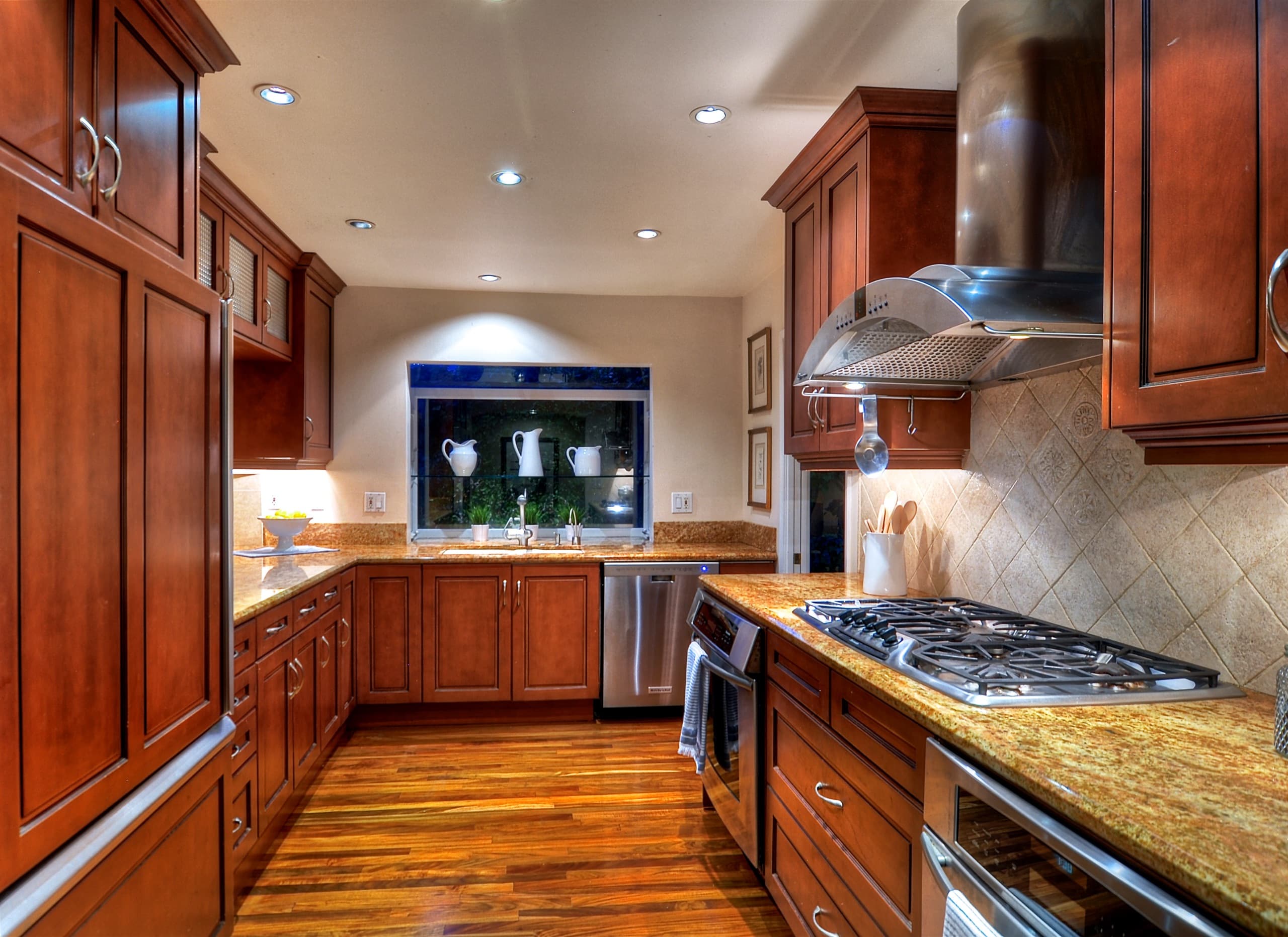 A remodeled kitchen with stainless appliances and hardwood floors in a Huntington Harbour home.
