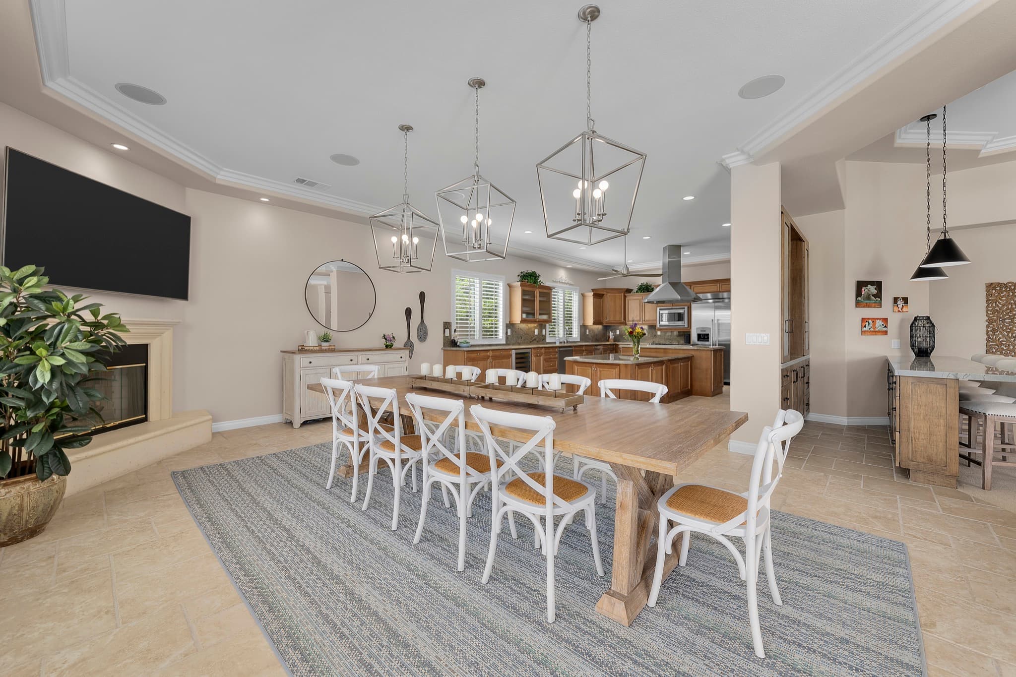 A staged open dining room and kitchen prepared for sale in Huntington Beach.