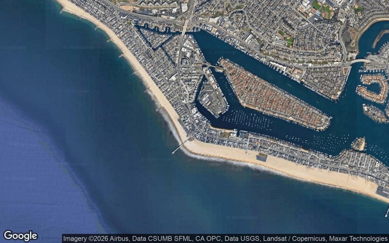 Satellite aerial view of the Balboa Peninsula in Newport Beach, California, showing the neighborhood's streets and surroundings.