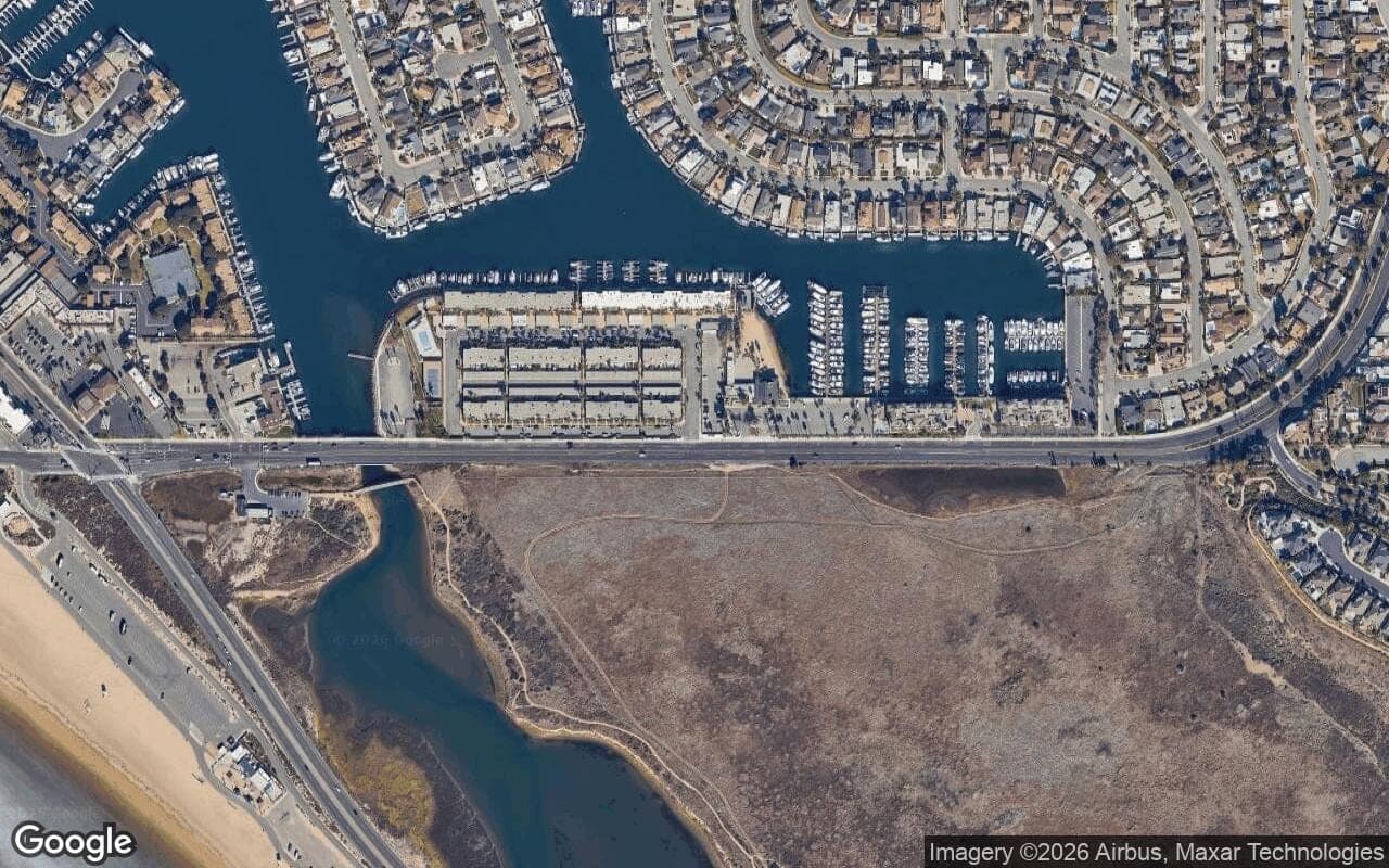Satellite aerial view of Bay Club in Huntington Beach, California, showing the neighborhood's streets and surroundings.