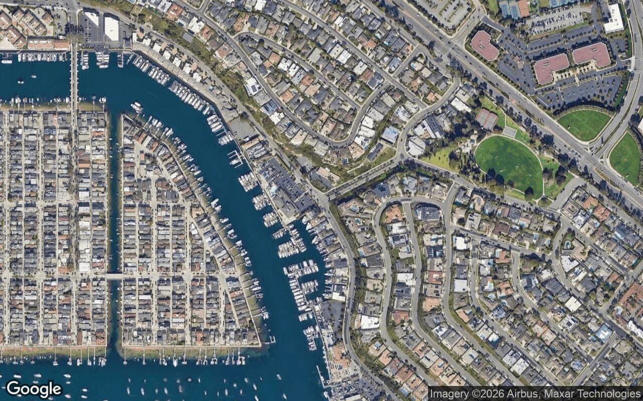 Satellite aerial view of Bayside Cove in Newport Beach, California, showing the neighborhood's streets and surroundings.
