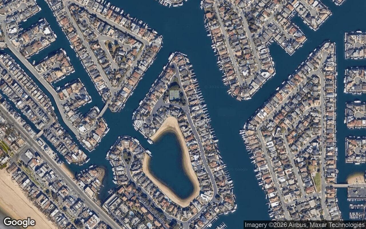 Satellite aerial view of Coral Cay in Huntington Beach, California, showing the neighborhood's streets and surroundings.