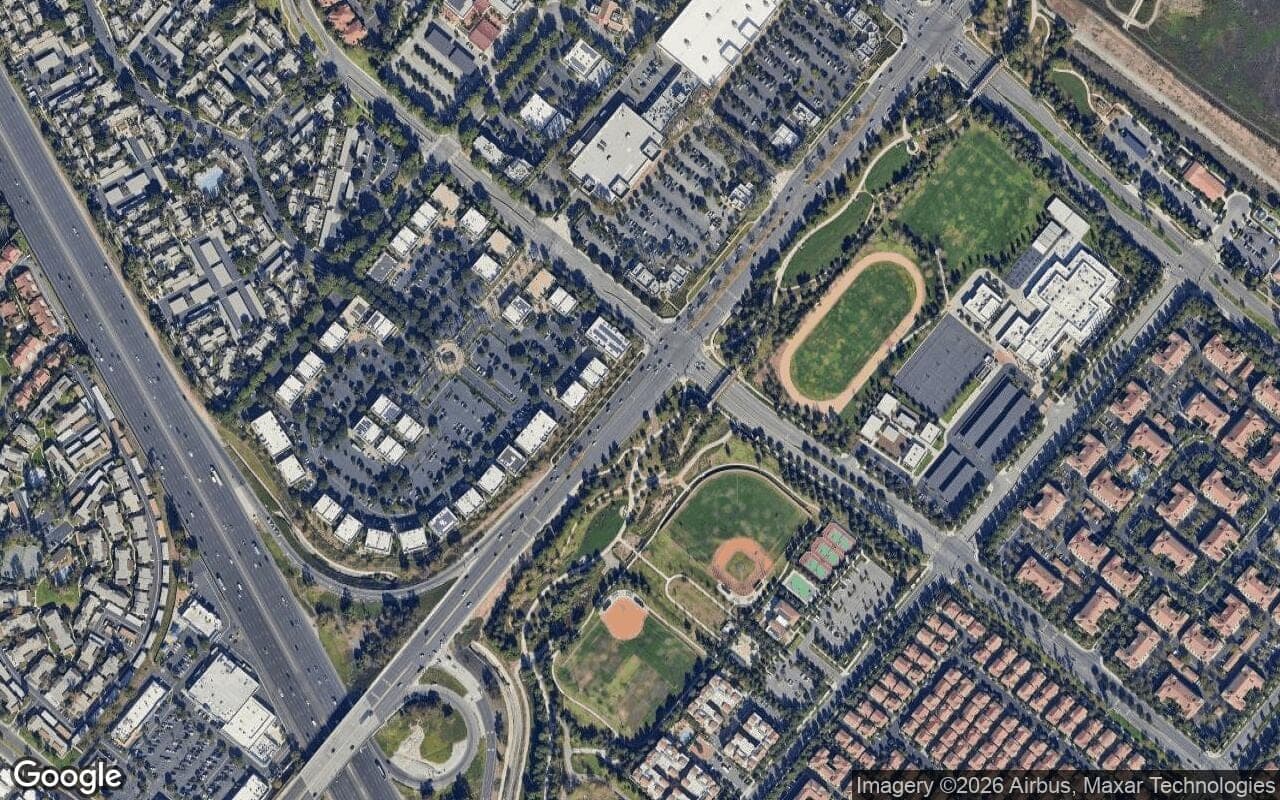 Satellite aerial view of Cypress Village in Irvine, California, showing the neighborhood's streets and surroundings.
