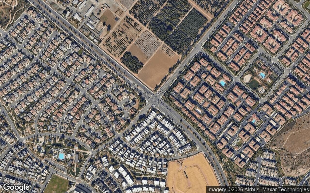 Satellite aerial view of Eastwood Village in Irvine, California, showing the neighborhood's streets and surroundings.