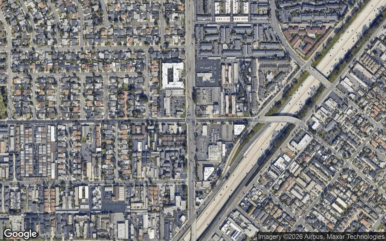 Satellite aerial view of Freedom Homes in Costa Mesa, California, showing the neighborhood's streets and surroundings.