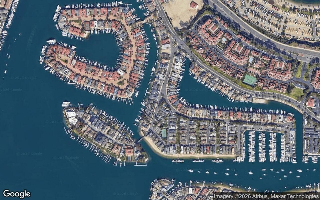 Satellite aerial view of Harbor Island in Newport Beach, California, showing the neighborhood's streets and surroundings.