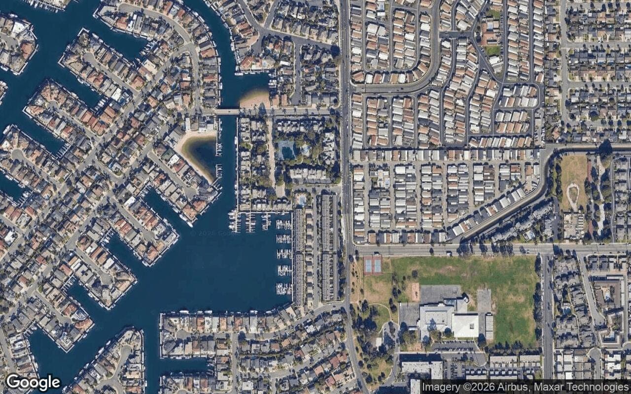 Satellite aerial view of Harbour Mainland in Huntington Beach, California, showing the neighborhood's streets and surroundings.