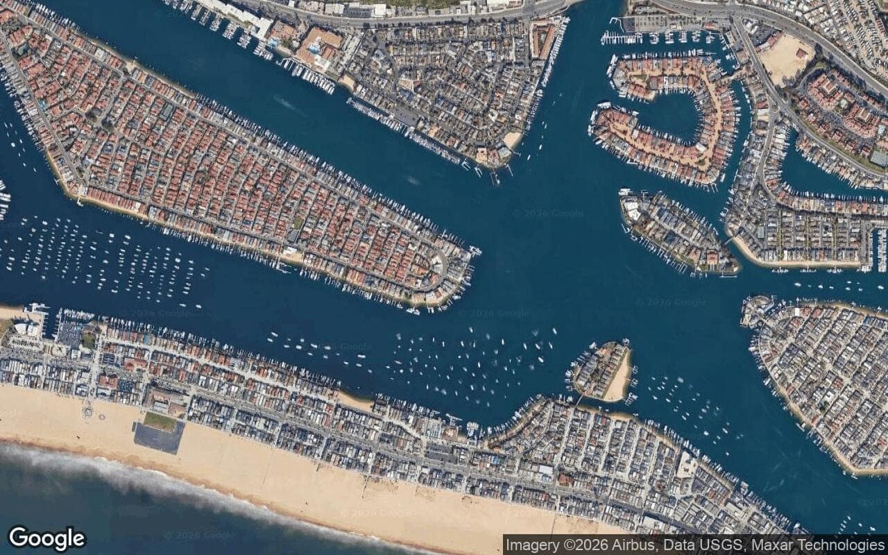 Satellite aerial view of Lido Isle in Newport Beach, California, showing the neighborhood's streets and surroundings.