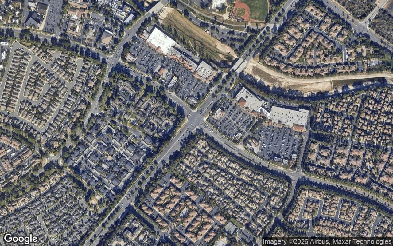 Satellite aerial view of Oak Creek in Irvine, California, showing the neighborhood's streets and surroundings.