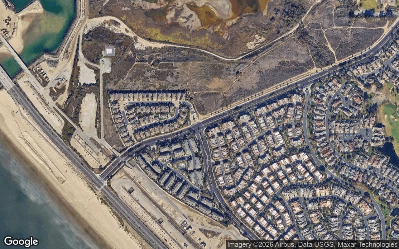 Satellite aerial view of Ocean Colony in Huntington Beach, California, showing the neighborhood's streets and surroundings.