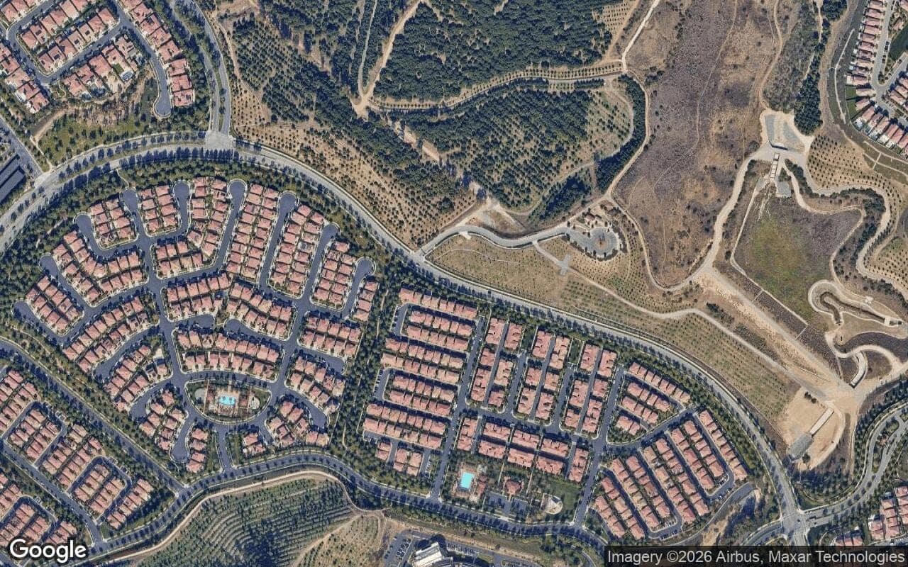 Satellite aerial view of Orchard Hills in Irvine, California, showing the neighborhood's streets and surroundings.