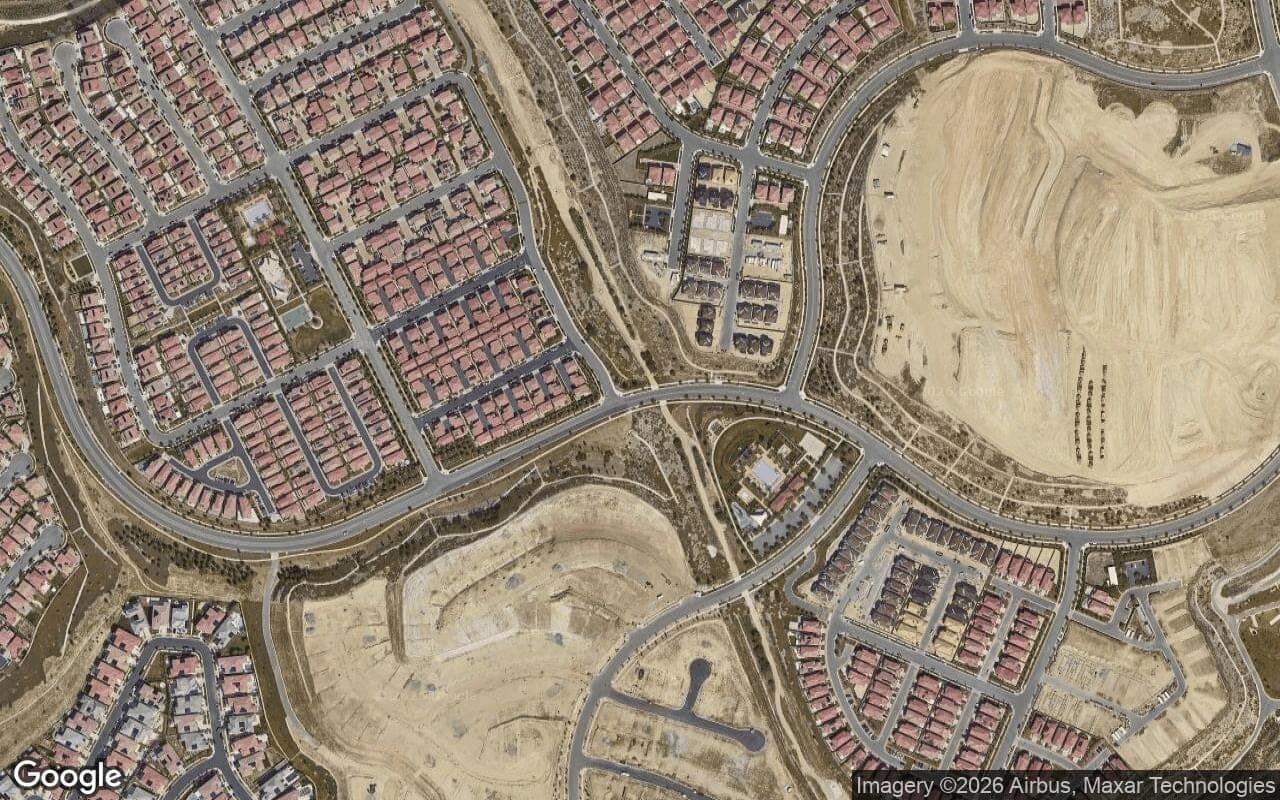 Satellite aerial view of Portola Springs in Irvine, California, showing the neighborhood's streets and surroundings.