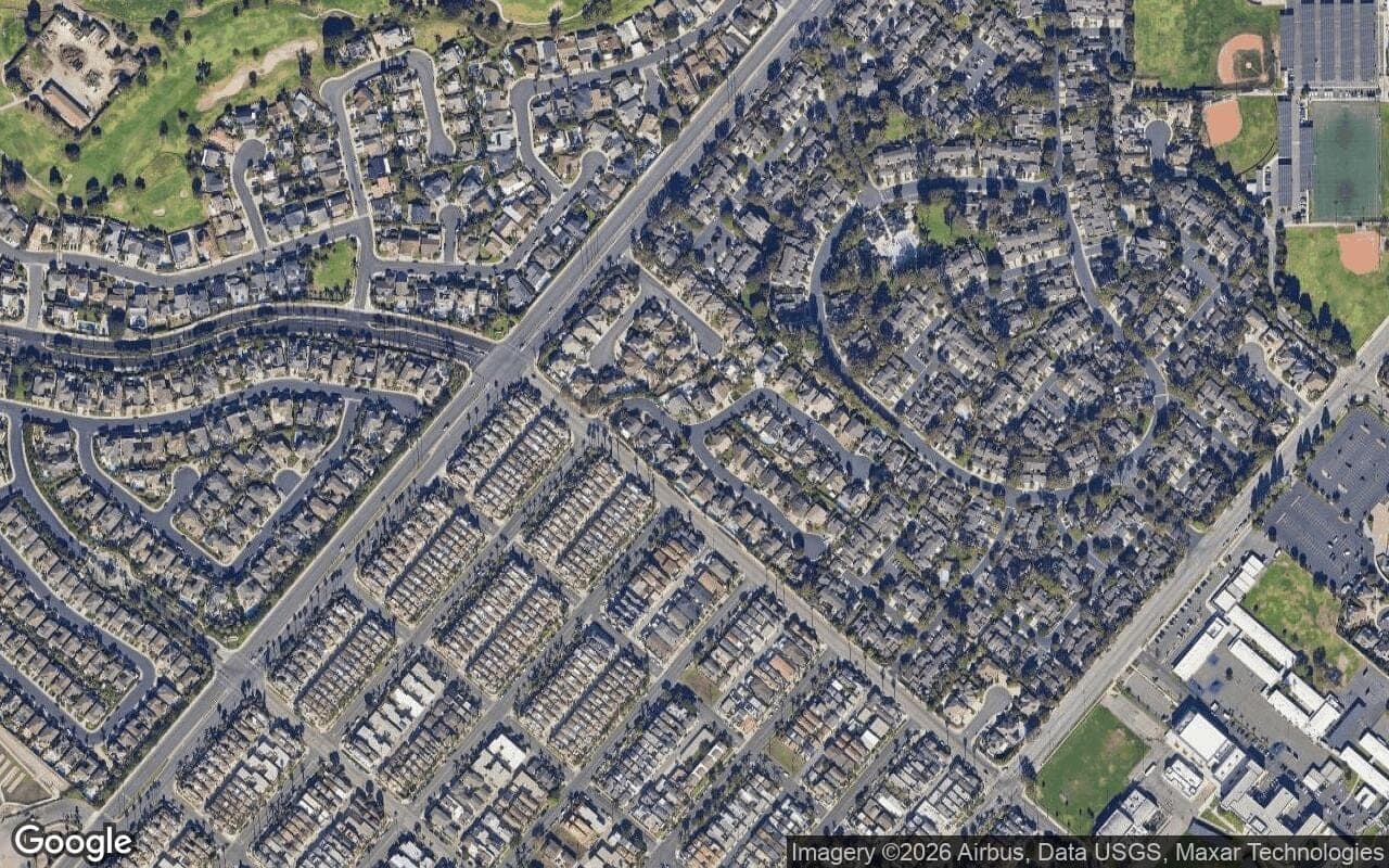 Satellite aerial view of Sand Castle Estates in Huntington Beach, California, showing the neighborhood's streets and surroundings.