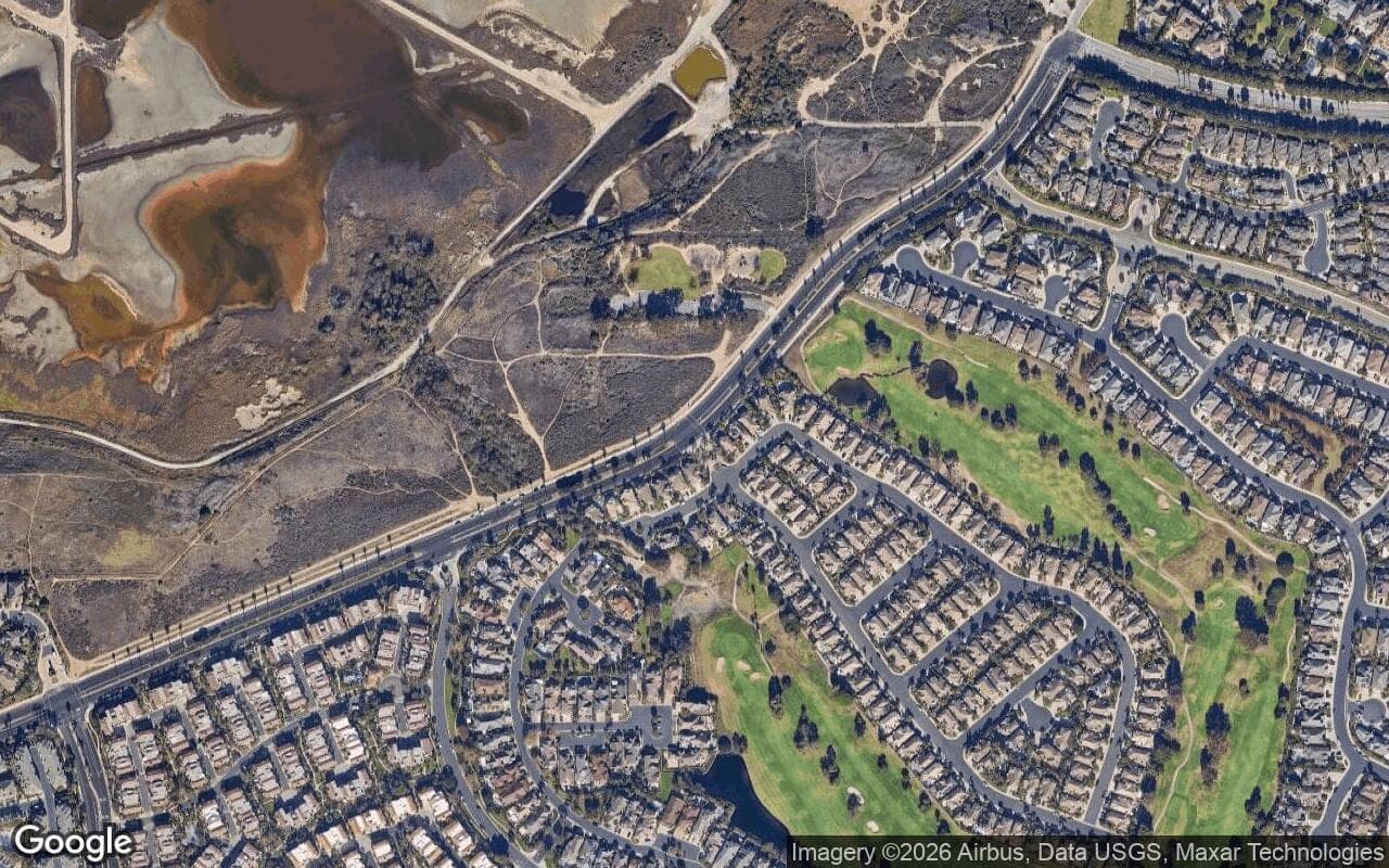 Satellite aerial view of The Estates at Seacliff Country Club in Huntington Beach, California, showing the neighborhood's streets and surroundings.