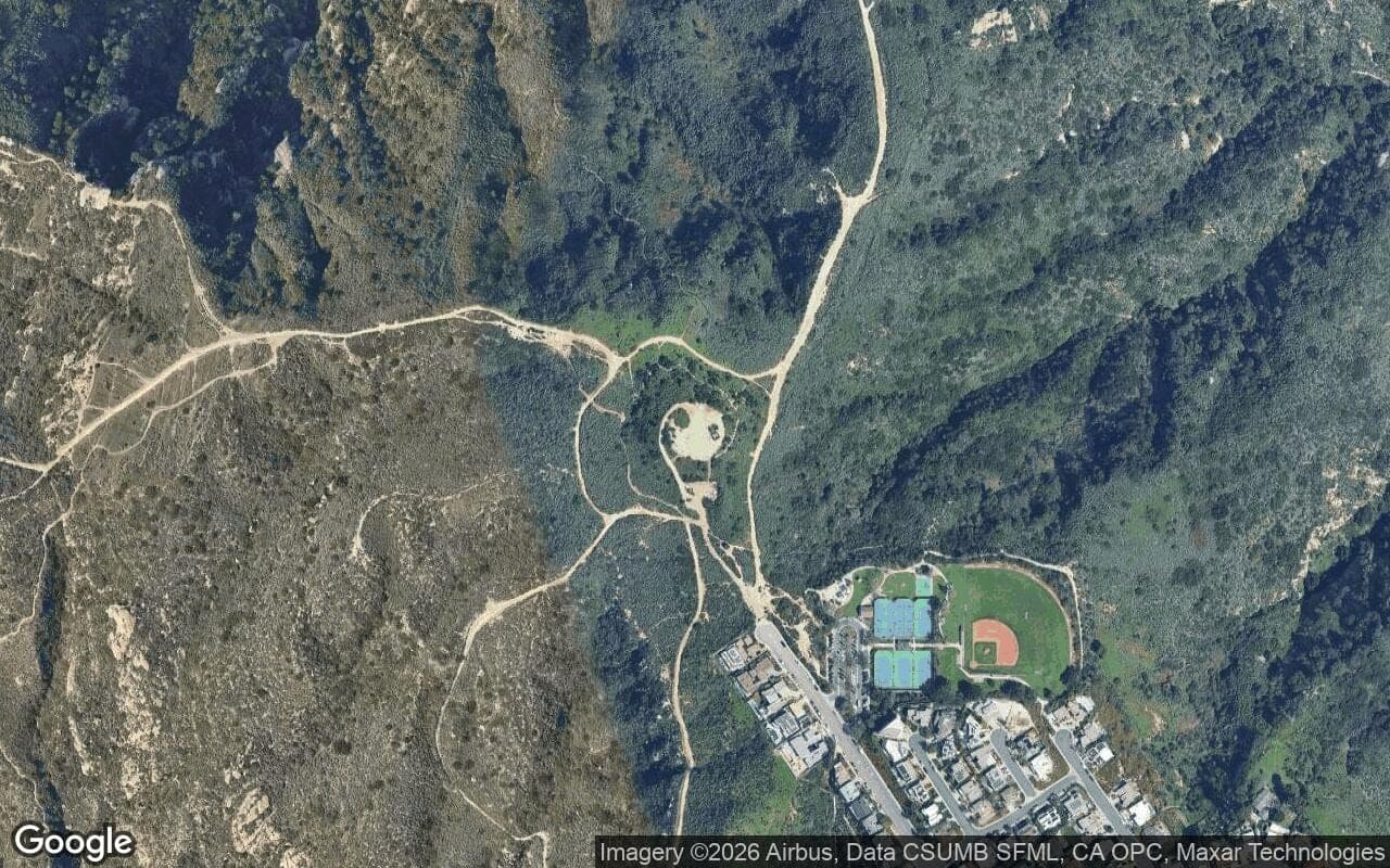 Satellite aerial view of Top of the World in Laguna Beach, California, showing the neighborhood's streets and surroundings.