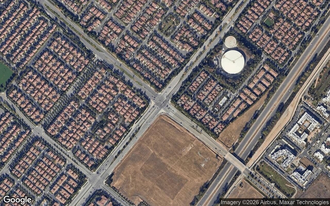 Satellite aerial view of Woodbury in Irvine, California, showing the neighborhood's streets and surroundings.