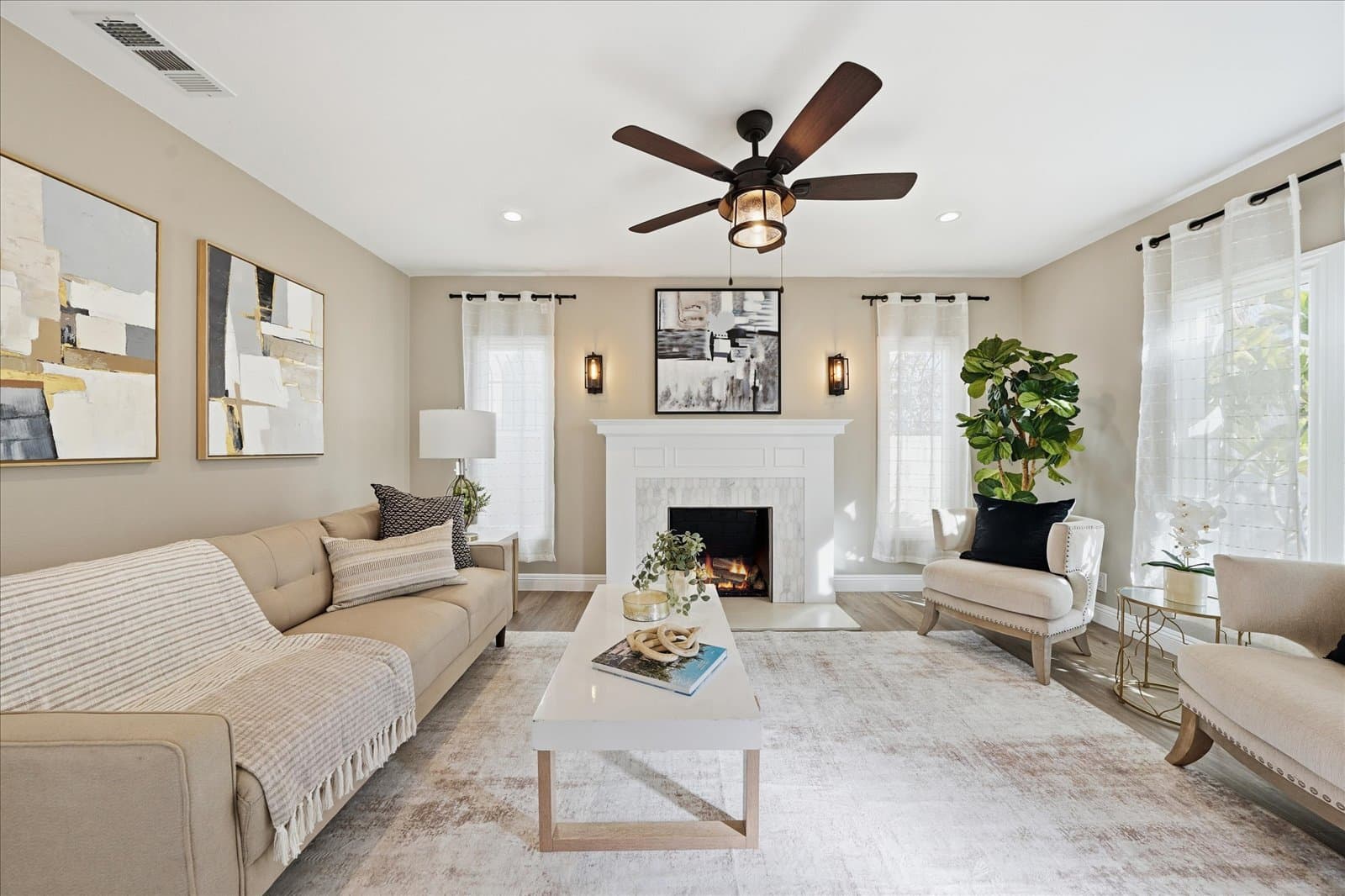 A comfortable living room with a fireplace in a Huntington Beach home.