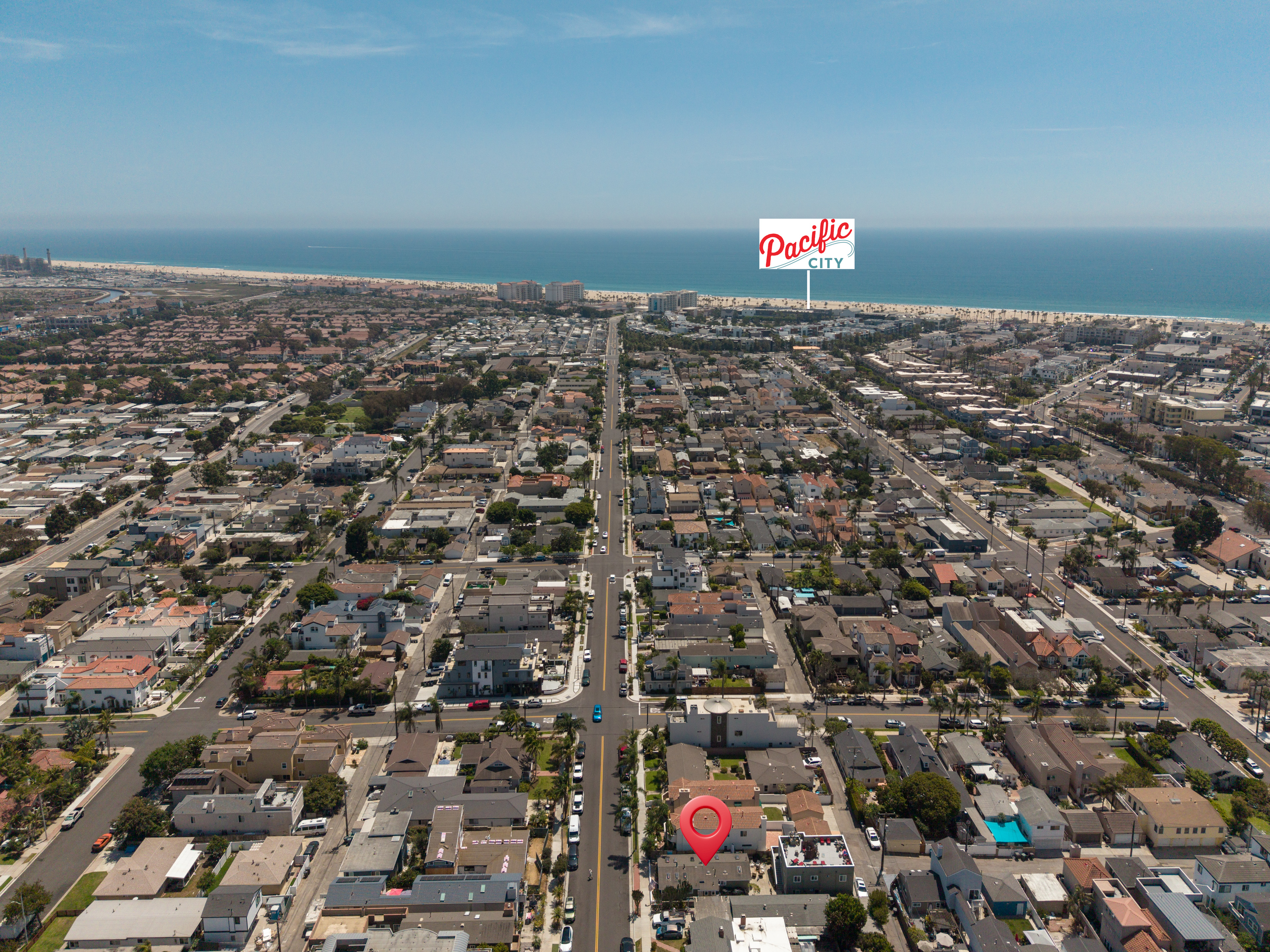 Aerial view of 711 Huntington Street in Downtown Huntington Beach, marked with its distance to Pacific City and the coastline.