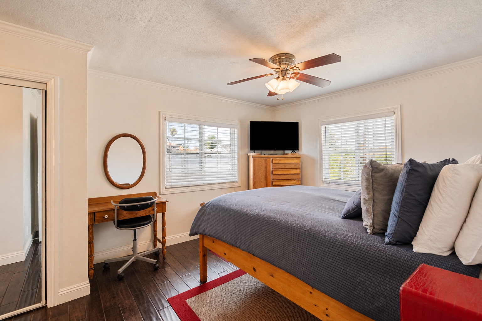 Bedroom with engineered wood flooring in the upper residence at 711 Huntington Street.
