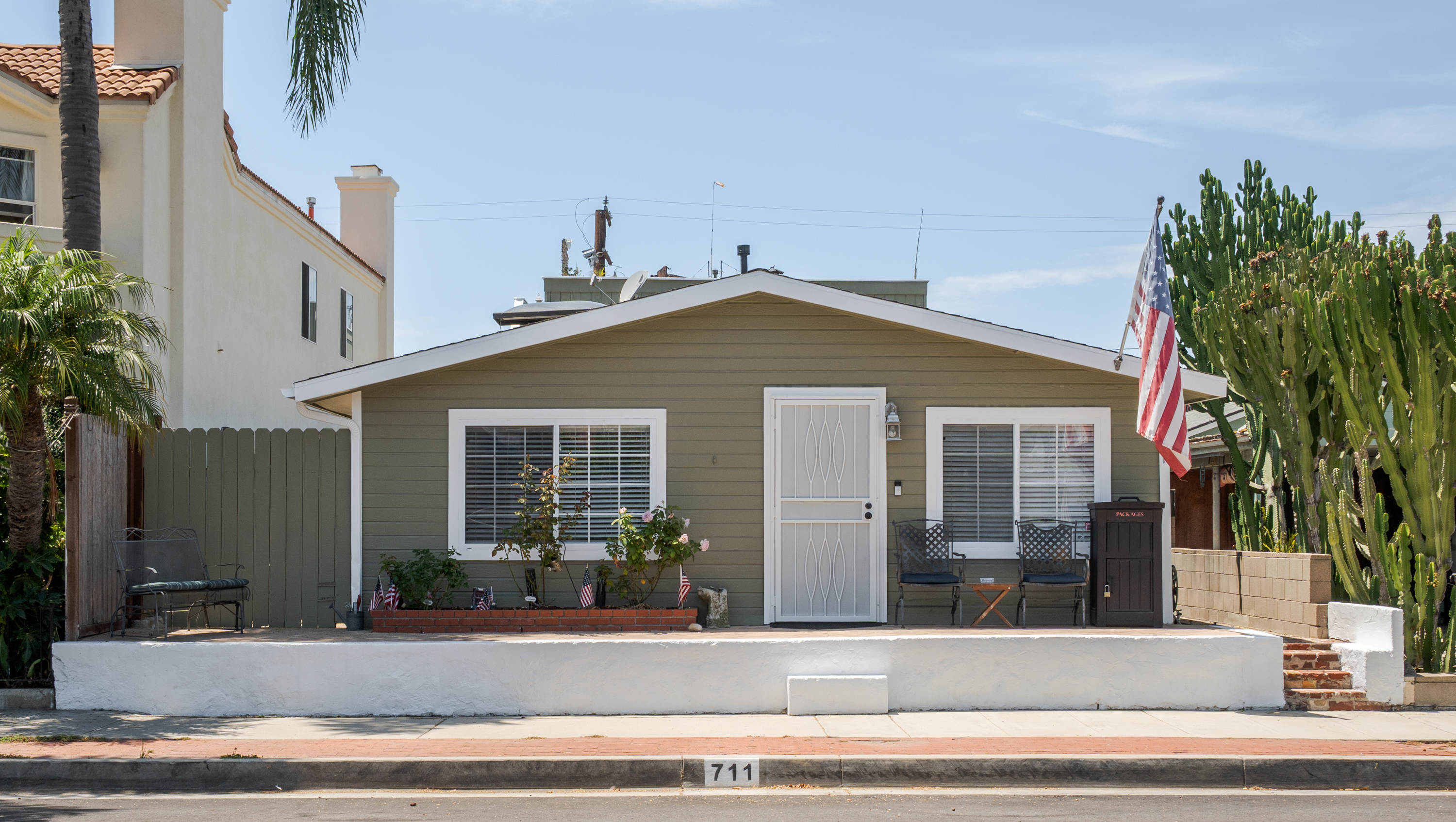 Front exterior of the detached residence at 711 Huntington Street, Huntington Beach.