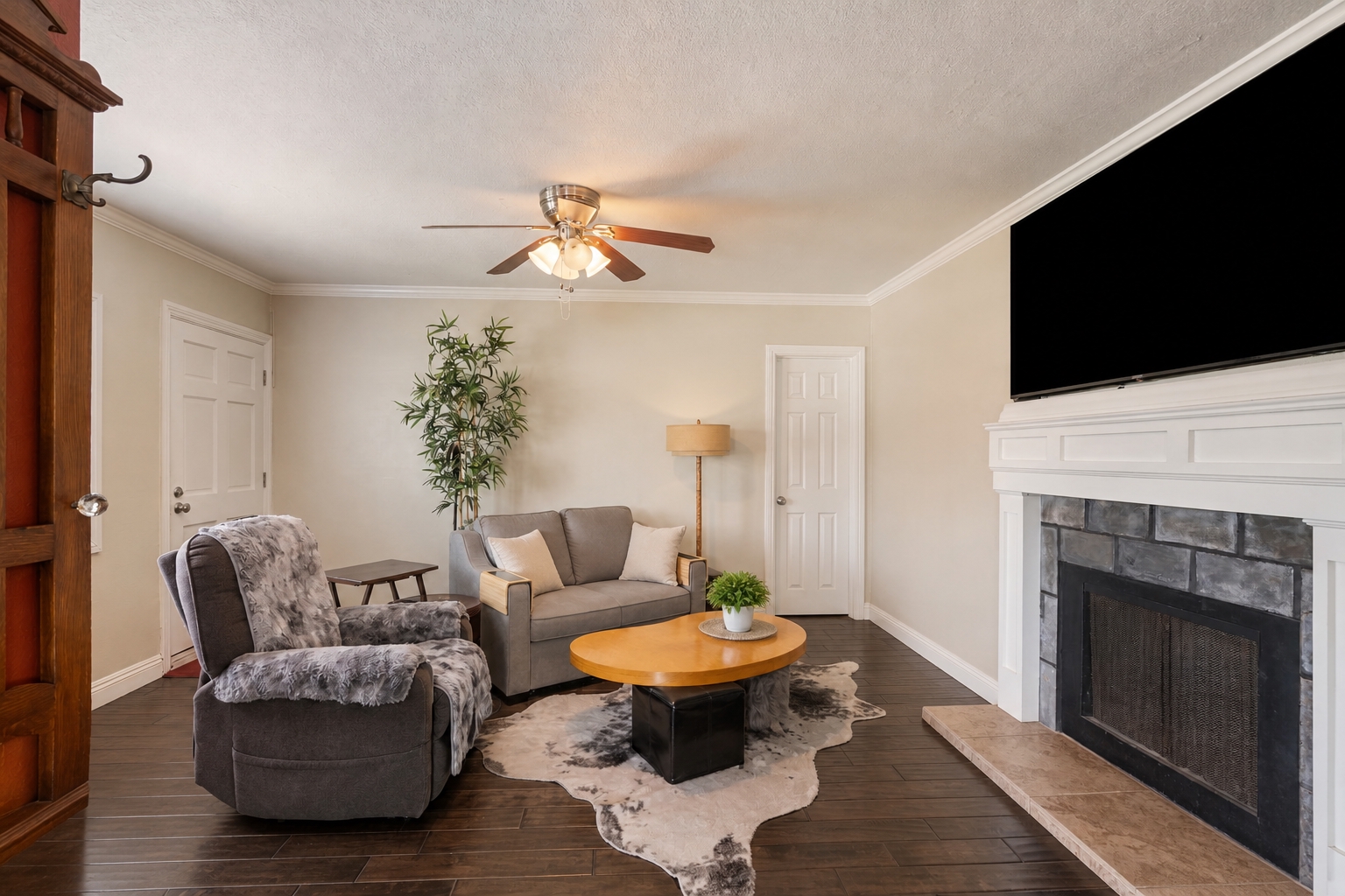 Living room with fireplace in one of the residences at 711 Huntington Street.